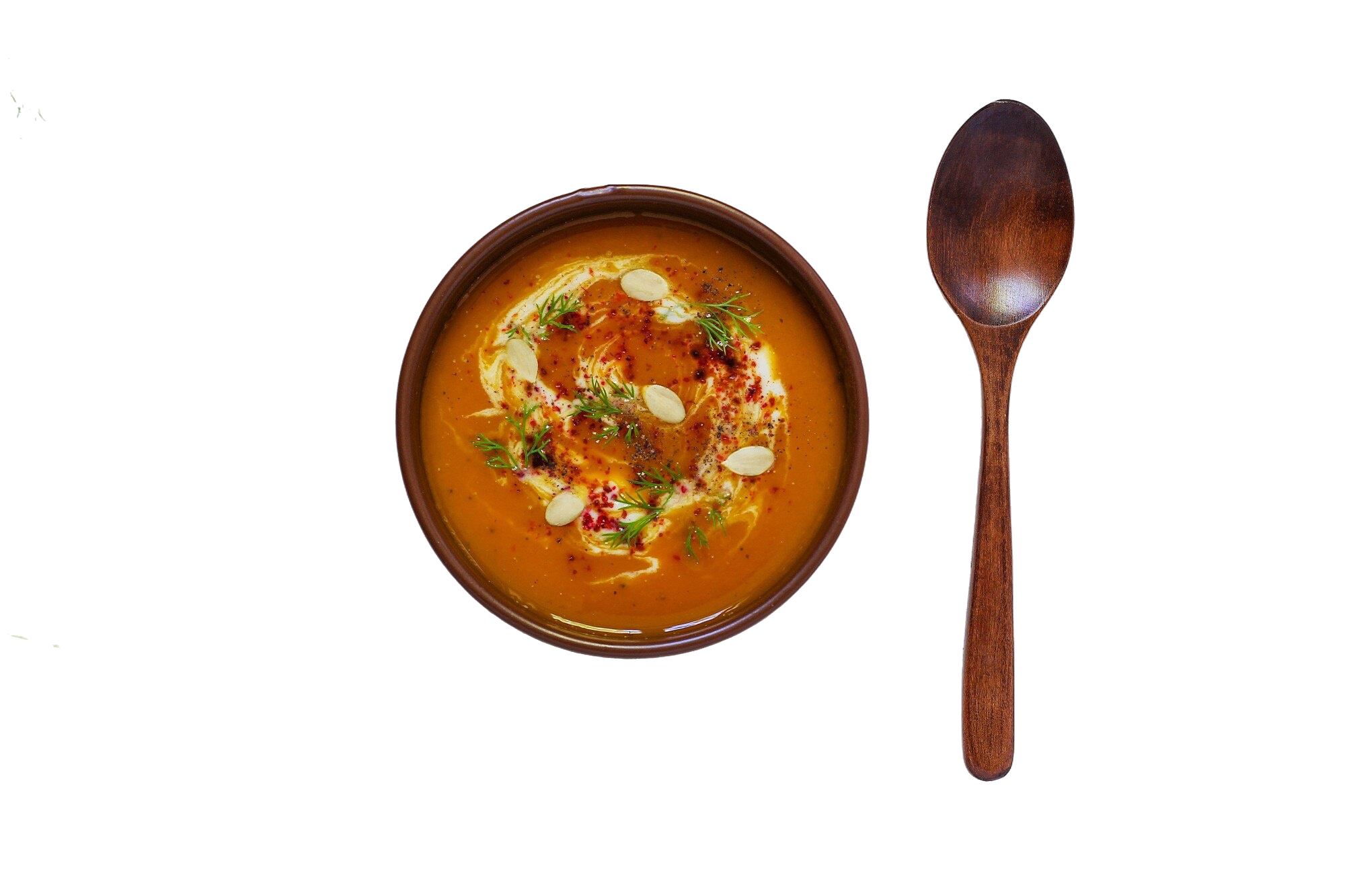 roasted pumpkin carrot soup with cream black pepper pumpkin seeds cutting board fresh pumpkin slices black bread